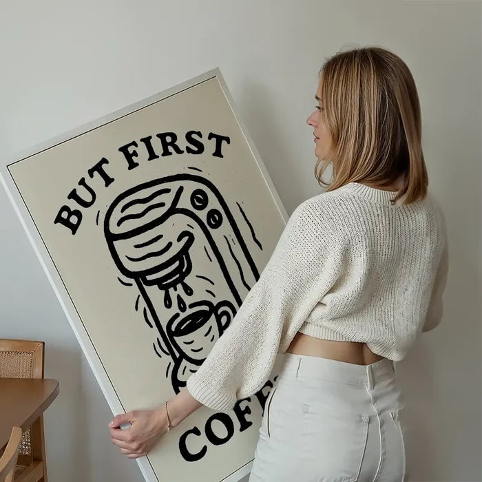 But First Coffee Quote Print held up against a living room wall