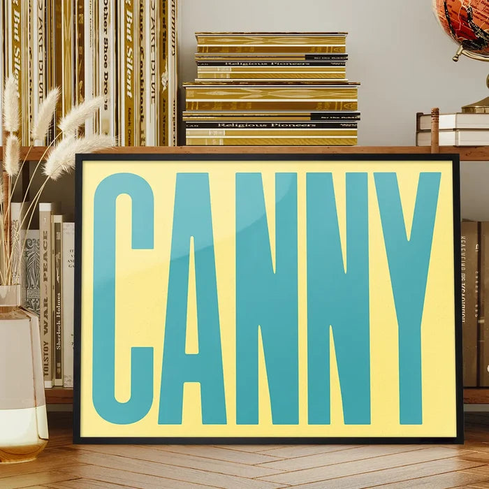 Canny Typography Quote Print - Duck Egg Blue framed on a living room bookshelf