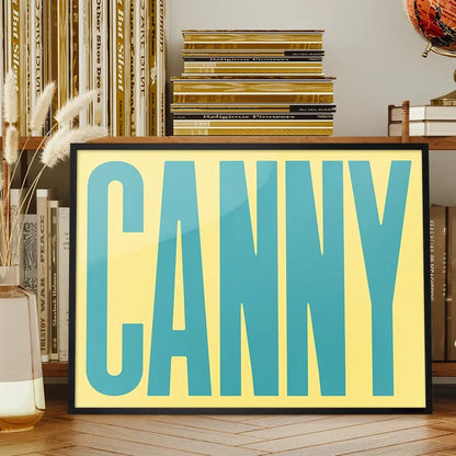 Canny Typography Quote Print - Duck Egg Blue framed on a living room bookshelf
