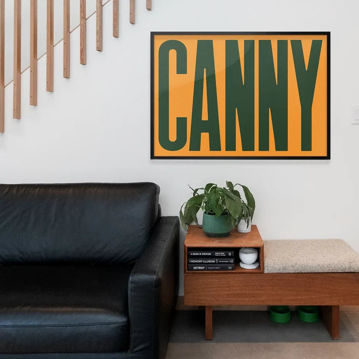Canny Typography Quote Print - Forest Green framed above a living room sofa