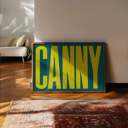 Canny Typography Quote Print - Lime Green framed, leaning on a wooden floor beside a rug