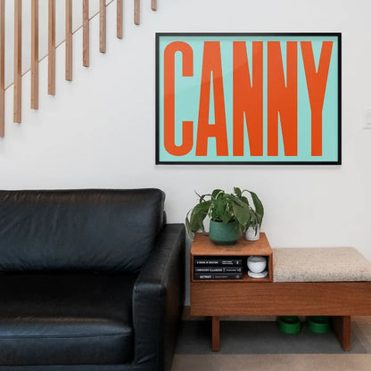 Canny Typography Quote Print - Orange framed above a living room sofa