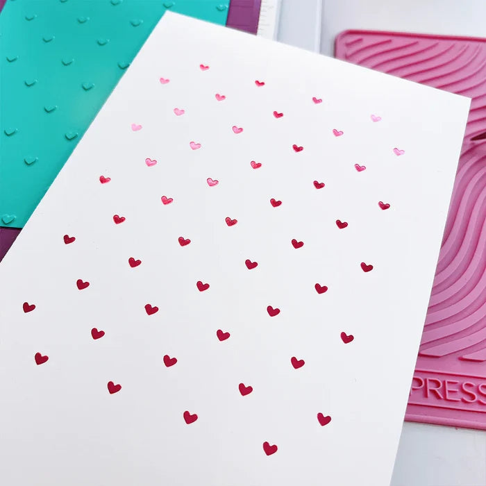 Catherine Pooler - Hot Foil Plate - Tiny Hearts. Who wouldn't love a foiled background of tiny hearts? The Tiny Hearts Hot Foil Plate is a fun way to add a repeating heart pattern to your next card or project. Available at Embellish Away located in Bowmanville Ontario Canada.