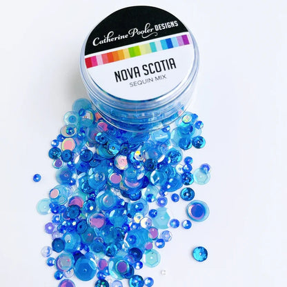 Catherine Pooler - Sequin Mix - Nova Scotia. The lobster is fine off the chilly shores of Nova Scotia, Canada. This cold water blue mix is shimmery and shiny and just right for your nautical cards and projects. Nova Scotia is ready for shaker cards. Available at Embellish Away located in Bowmanville Ontario Canada.