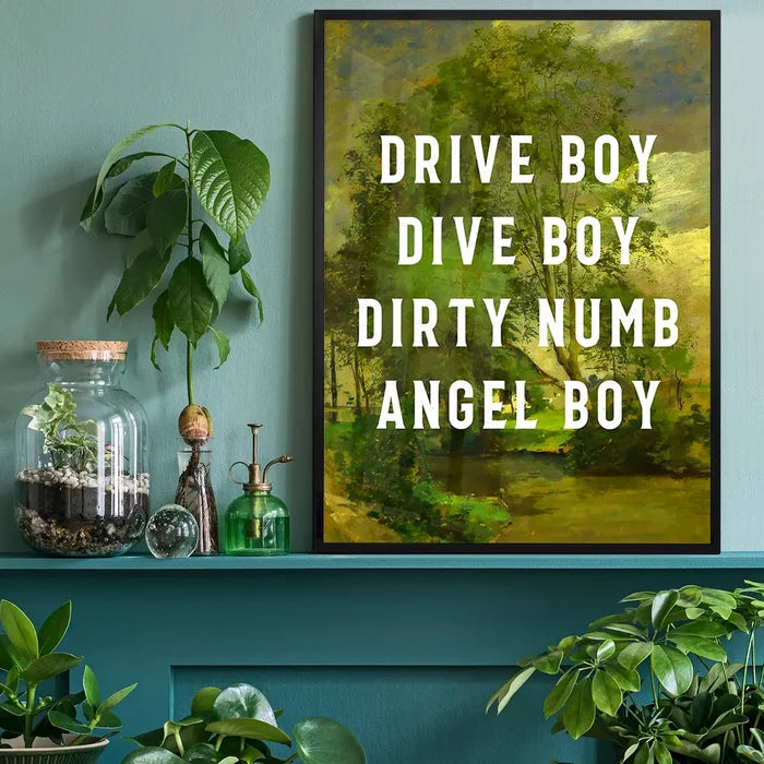 Drive Boy Dive Boy Born Slippy Quote Print black framed on a living room shelf