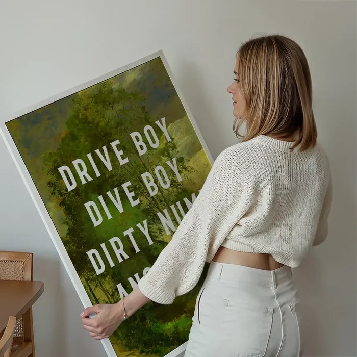 Drive Boy Dive Boy Born Slippy Quote Print held up against a living room wall