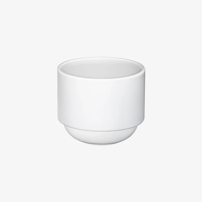 Hasami Porcelain rounded bottom tea cup in white, showcasing modern design and multifunctional features.