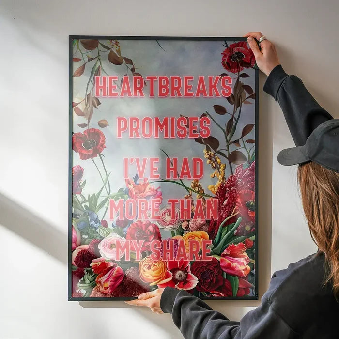 Heartbreak Promises Lyrics Quote Print being hung on a wall in a black frame