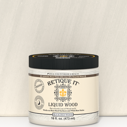 Close-up of 16oz bottle of Retique It Liquid Wood in Bleached for interior use, showing the product label and packaging.