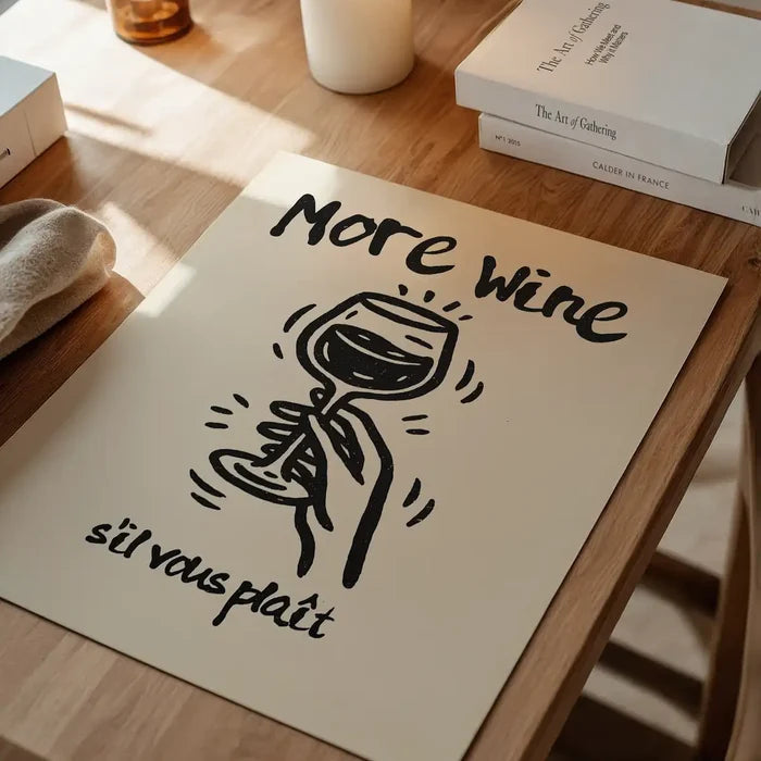 More Wine s'il vous plaît Quote Print unframed on a home office desk