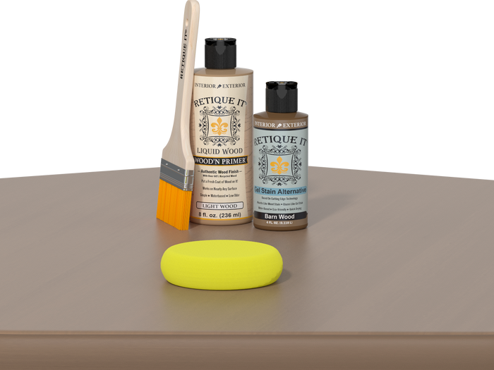 Retique It® Barn Wood Kit with Light Wood’n Primer, Barn Wood Gel Stain Alternative, paintbrush, and yellow sponge on a wood tabletop.