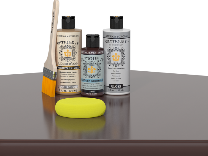 Retique It® Light Wood Wood’n Primer with Java Gel Stain Alternative, gloss topcoat, brush, and yellow sponge on a reflective tabletop.