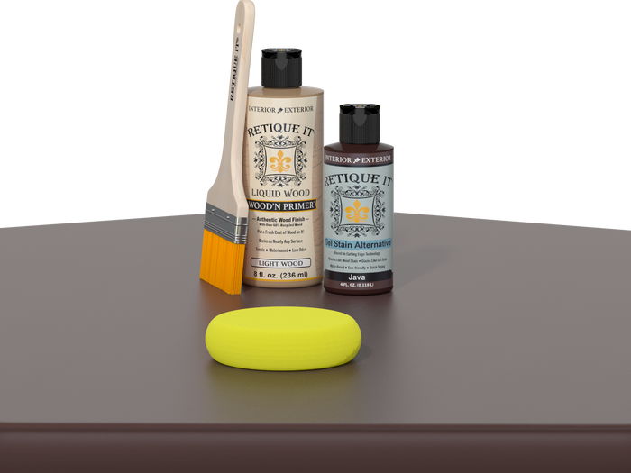 Retique It® Java Kit with Light Wood’n Primer, Java Gel Stain Alternative, paintbrush, and yellow sponge on a dark wood tabletop.