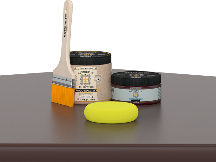 Retique It® Java Multipurpose Kit contents with Liquid Wood primer, Java gel stain alternative, paintbrush, and yellow sponge displayed on a dark wood surface.