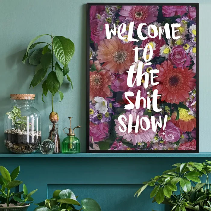 Shit Show Quote Print black framed on a living room shelf