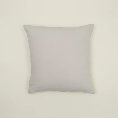 Simple light gray linen pillow, made from Belgian linen, adding casual luxury to any cozy space.