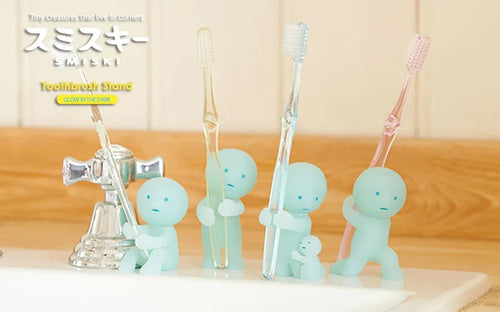Smiski Toothbrush Stands, whimsical figures for toothbrushes, feature playful poses and glow in the dark, embodying the quirky charm of Strangecat Toys.