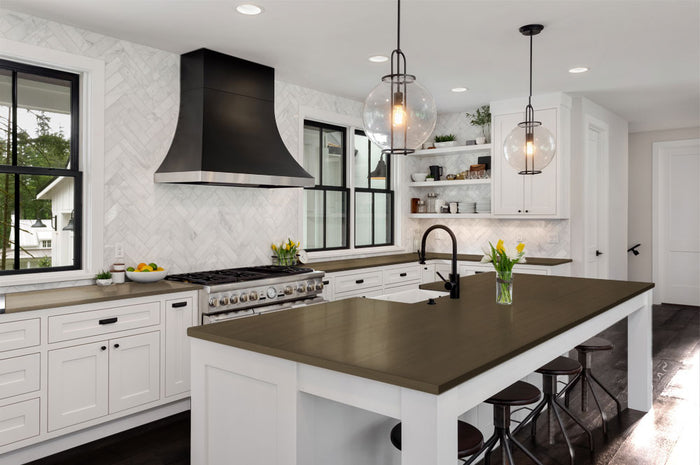 Retique It black walnut wood finish kit applied to a kitchen countertop with a smooth, polished surface.