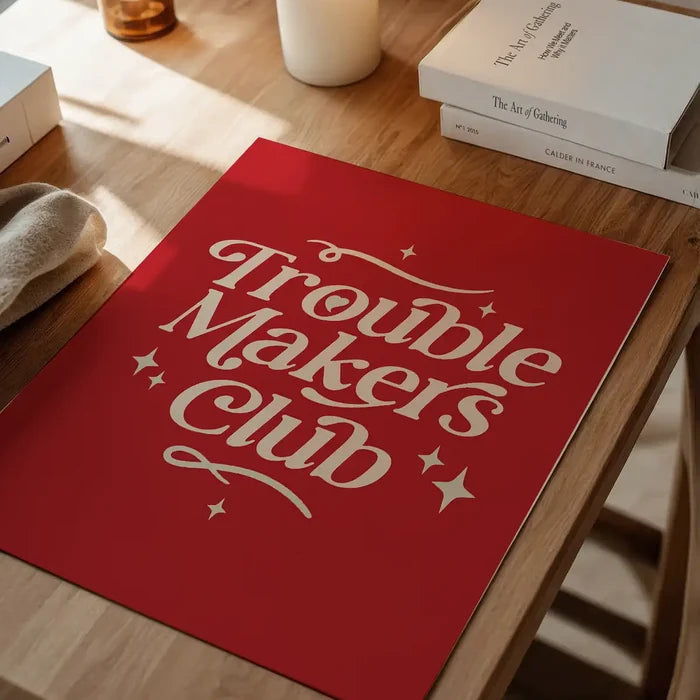 Trouble Makers Club Quote Print unframed on a home office desk