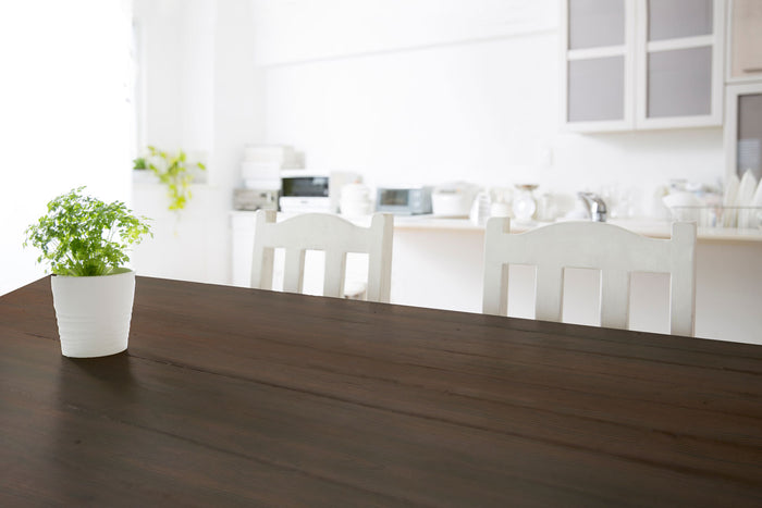 Retique It Weathered Finish Kit in Black Walnut applied to a wooden tabletop, showcasing a rustic, textured wood finish.