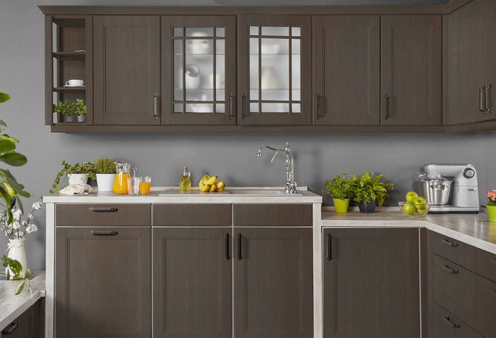 Retique It weathered finish kit in black walnut applied to kitchen cabinets, showcasing a rustic, textured wood finish.