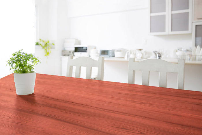 Retique It Weathered Finish Kit in Rustic Red applied to wood tabletop, showcasing a distressed, weathered red wood finish.