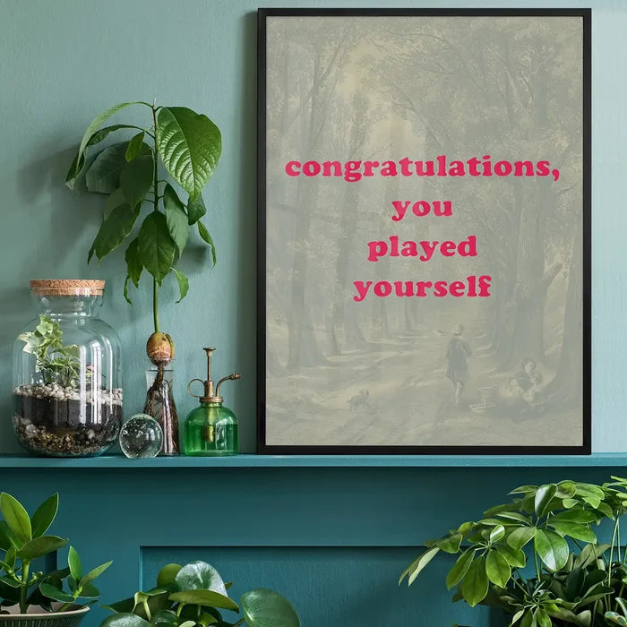 You Played Yourself Quote Print black framed on a living room shelf